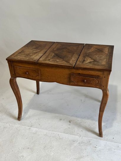 Moulded walnut dressing table, the top opening...