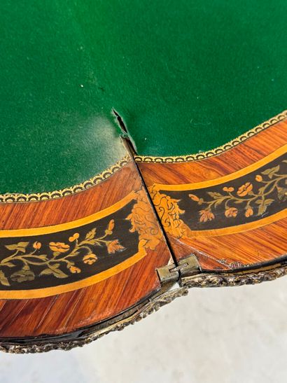 Wood and marquetry game table featuring a...