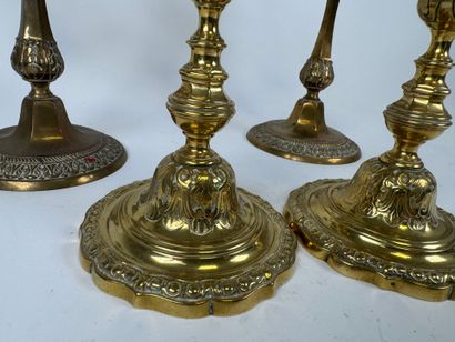 Two pairs of brass torches or candlesticks,...