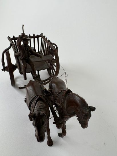 Small regule subject depicting a carriage.
11...