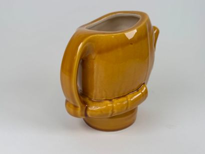 Yellow-glazed earthenware pitcher with Cyrano...