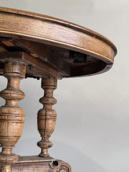 Large molded oak pedestal table on casters.
Henry...