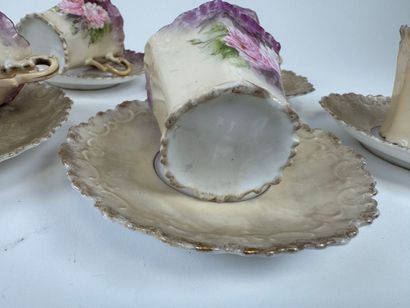 Part of a polychrome and gold porcelain coffee...