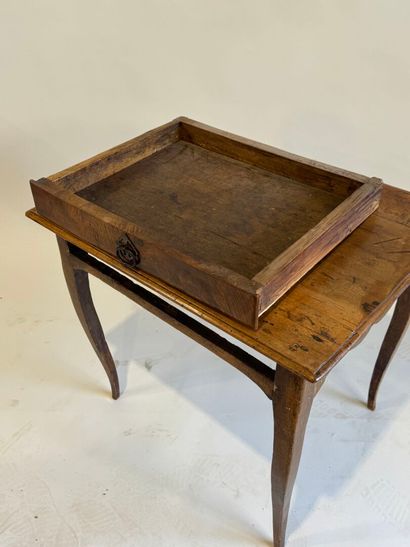 Small rustic table in molded walnut opening...