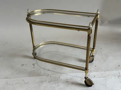 Small gilded metal and glass-topped rolling...
