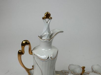Small white and gold porcelain liqueur service...
