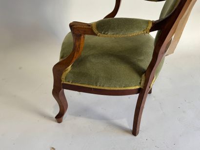Moulded mahogany armchair with green velvet...