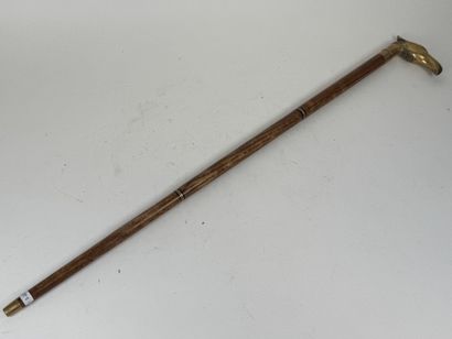 Wooden and brass system cane, the pommel...