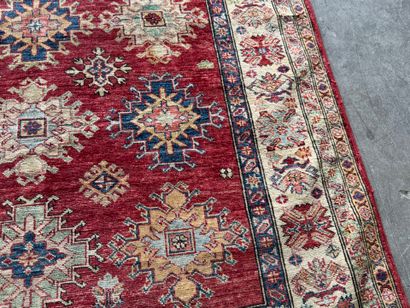 KAZAK. 
Polychrome wool carpet, the central...