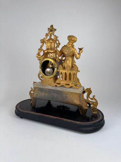 Gilded regule and alabaster clock decorated...