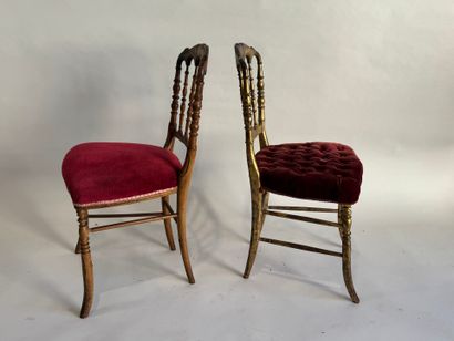 Two charivari chairs in molded and gilded...