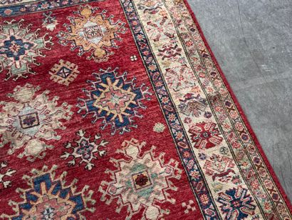 KAZAK. 
Polychrome wool carpet, the central...