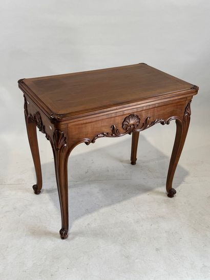 Molded and carved wood game table opening...