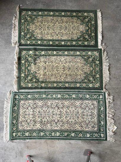 IRAN. 
Suite of three polychrome wool carpets...