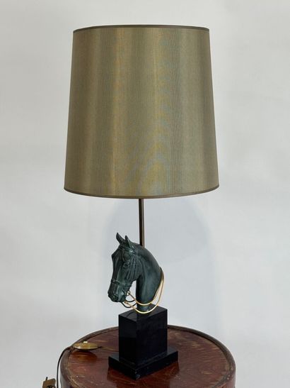 Regula lamp with green patina featuring a...