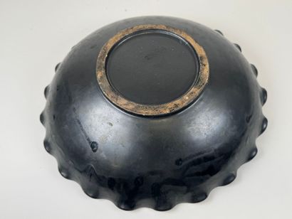 VALLAURIS.
Large ceramic bowl on black ground...