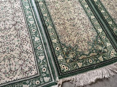 IRAN. 
Suite of three polychrome wool carpets...