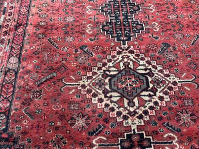 Polychrome wool carpet with stylized motifs...