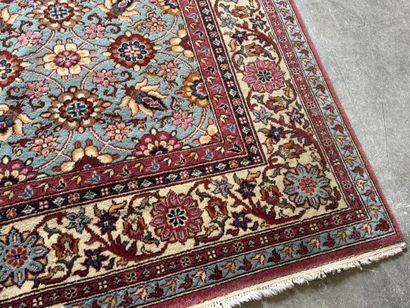 Polychrome wool carpet with floral motifs....