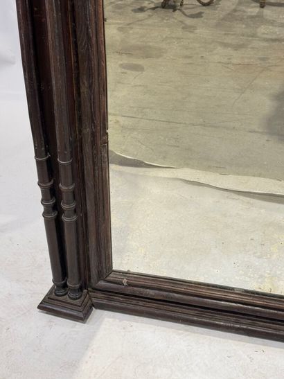 Large mirror in stained wood, the uprights...