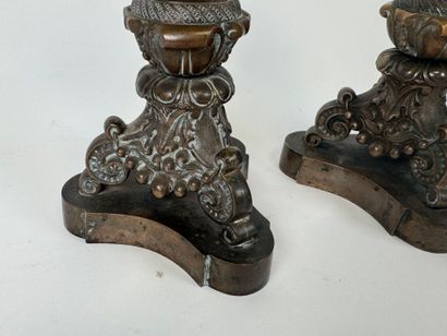Pair of tripod candlesticks in patinated...