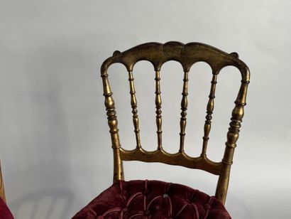 Two charivari chairs in molded and gilded...