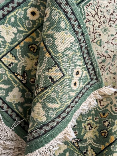 IRAN. 
Suite of three polychrome wool carpets...