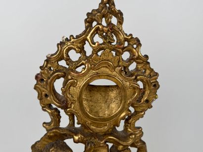 Carved and gilded wood and stucco watch-holder...