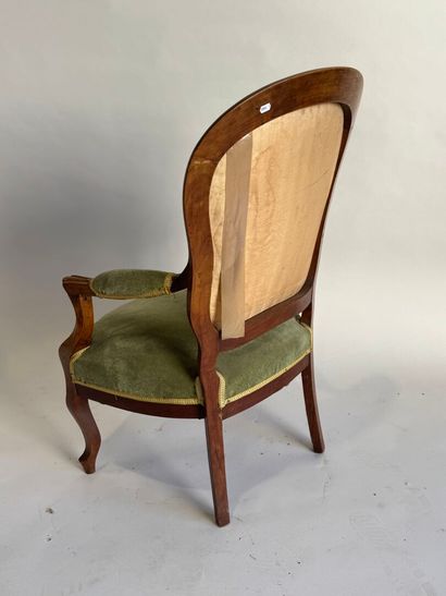 Moulded mahogany armchair with green velvet...