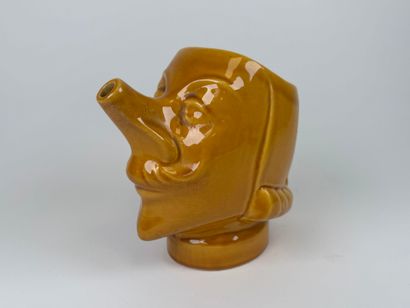 Yellow-glazed earthenware pitcher with Cyrano...