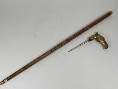Wooden and brass system cane, the pommel...