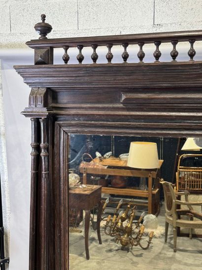 Large mirror in stained wood, the uprights...