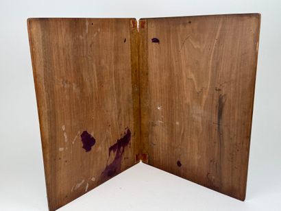 A two-plate folio in carved wood with the...