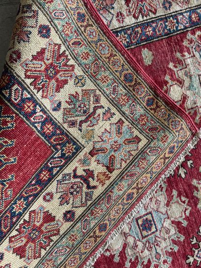 KAZAK. 
Polychrome wool carpet, the central...