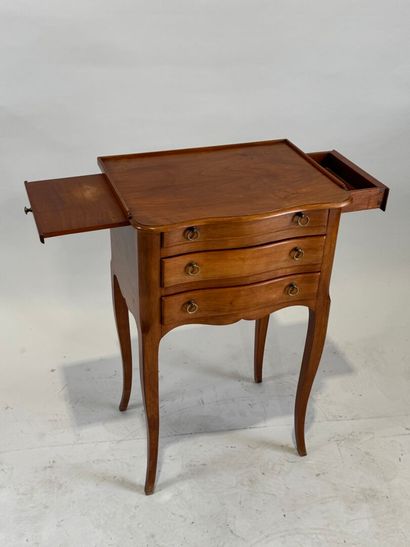 Moulded wood bedside table opening with three...