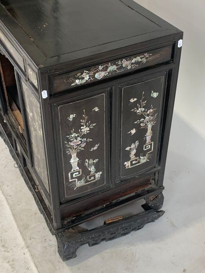 ASIA, 20th C. Low cabinet opening with two...