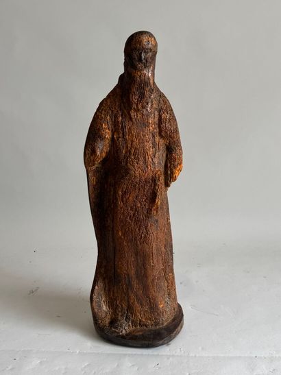 Wooden sculpture of an ecclesiastical figure....