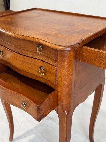 Moulded wood bedside table opening with three...