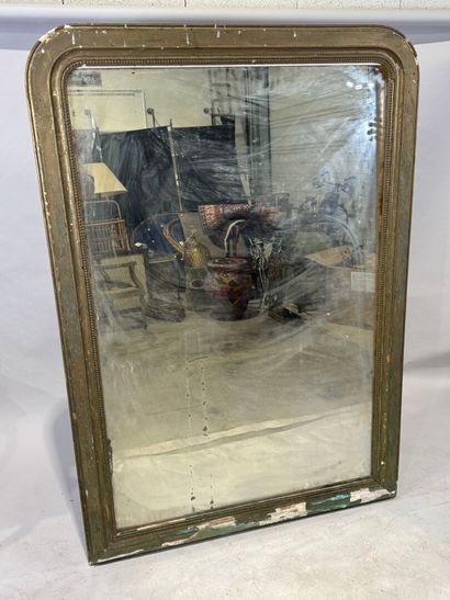 Large mirror in wood and gilded stucco decorated...