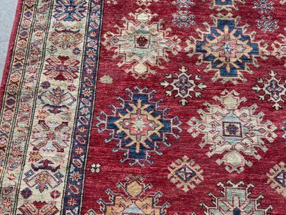 KAZAK. 
Polychrome wool carpet, the central...