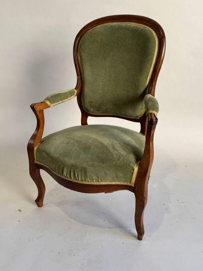 Moulded mahogany armchair with green velvet...