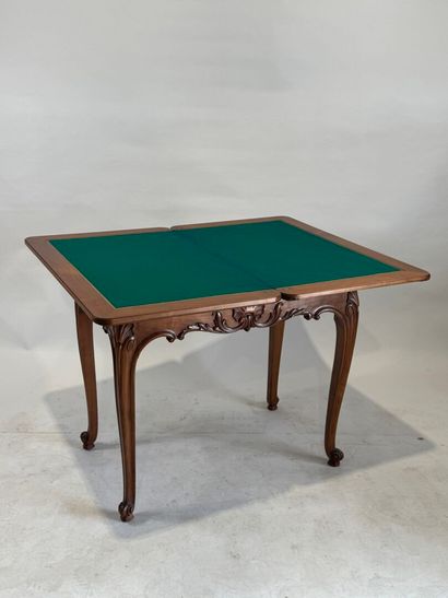Molded and carved wood game table opening...