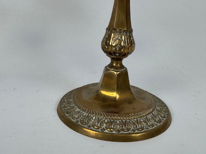 Two pairs of brass torches or candlesticks,...