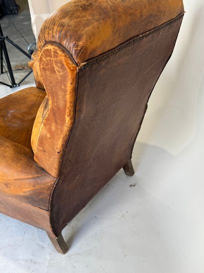 Club armchair in havana leather with arched...