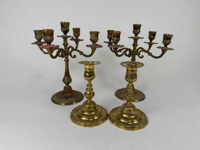 Two pairs of brass torches or candlesticks,...