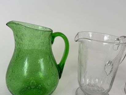 Three glass pitchers, one bubbled colored...