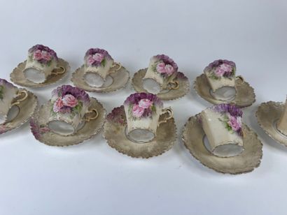 Part of a polychrome and gold porcelain coffee...
