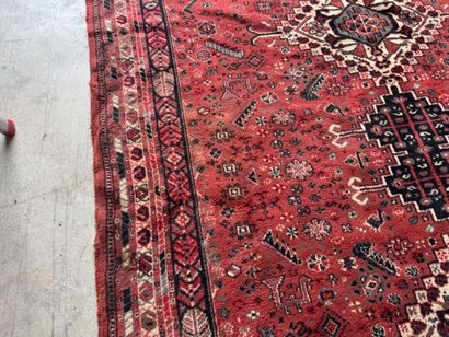 Polychrome wool carpet with stylized motifs...