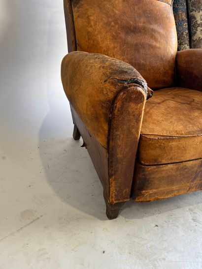 Club armchair in havana leather with arched...