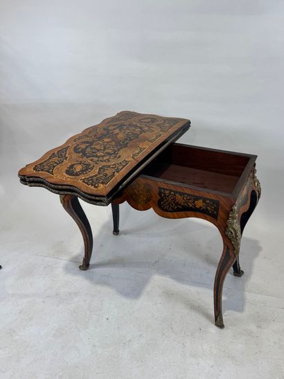 Wood and marquetry game table featuring a...